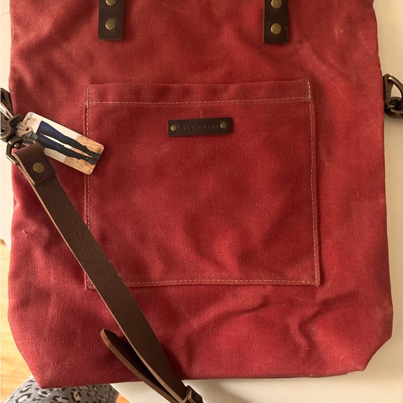 I’m selling brand new red house bag with tag